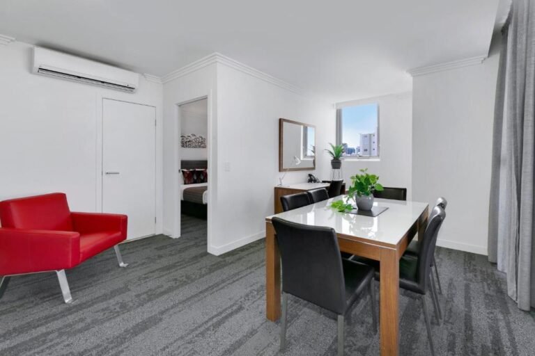 Open plan living area in a one-bedroom apartment at Hotel Diana South Brisbane
