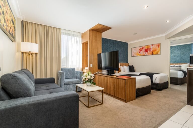 Family Suite at Hotel Diana Woollongabba featuring separate bedroom and open plan living, kitchen and bedroom area